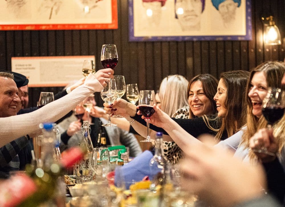 Guests raising glasses on opening night