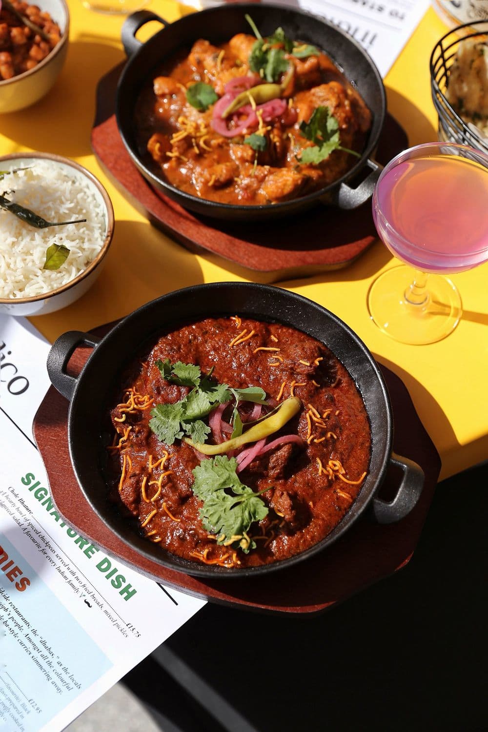 Curry in a karahi with naan, from above